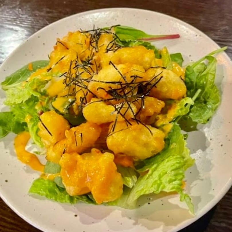 Kenzo Thai & Sushi's crispy shrimp tempura with spicy mayo and seaweed on a bed of lettuce.